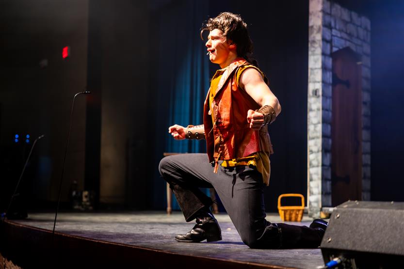 Actors perform onstage
